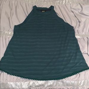 High neck tank with hem detail.